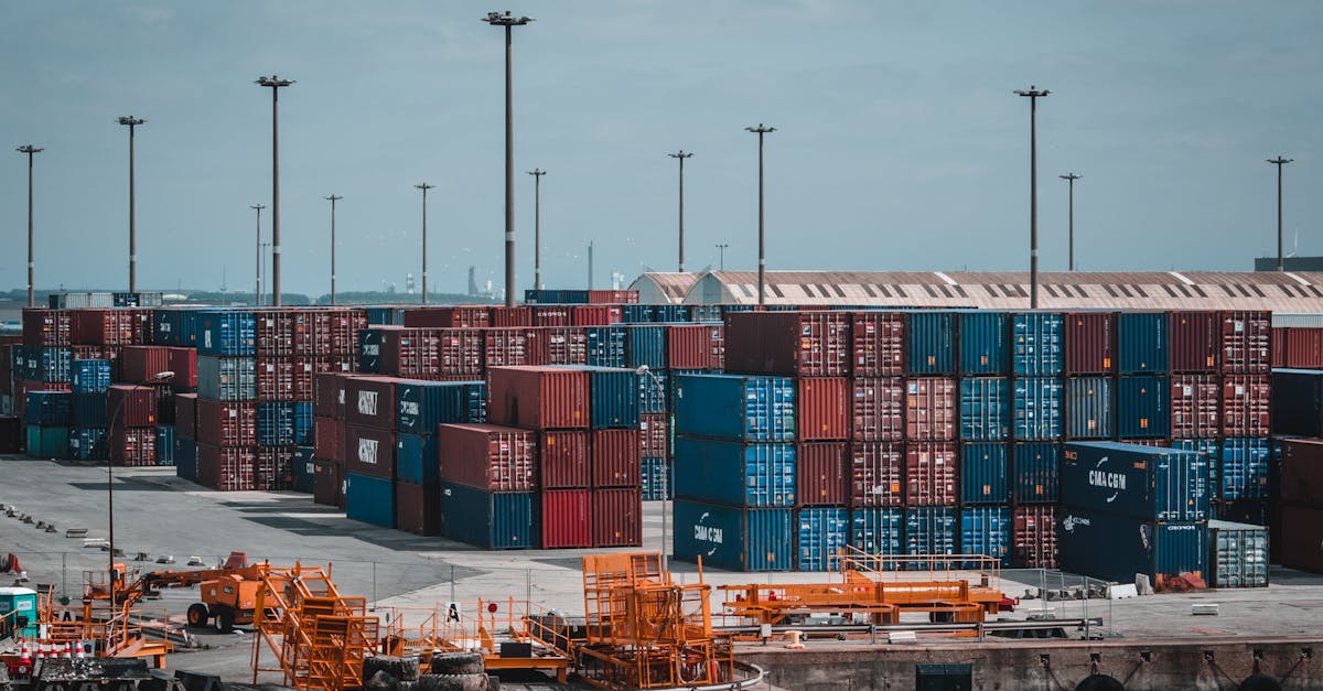 Colorful cargo containers stacked at a busy industrial port, showcasing global trade.
